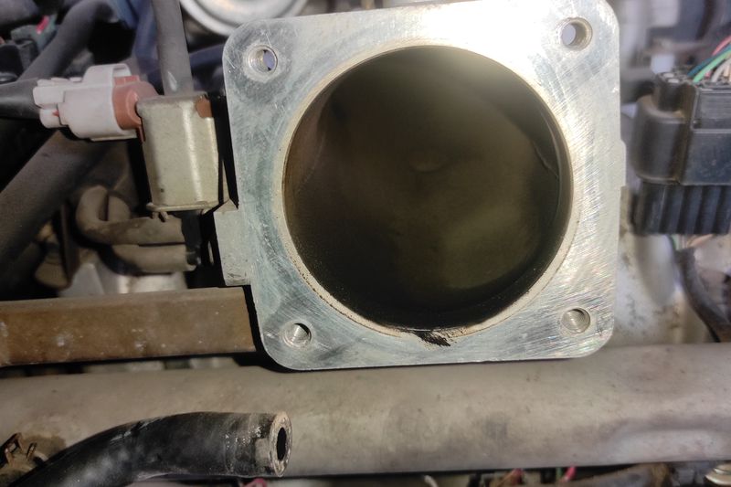 Mitsubishi Pajero. Снятие и чистка дроссельной заслонки. Чистка и смазка вала ингибитора АКПП. Mitsubishi Pajero. Throttle body removal and cleaning. Cleaning and lubricating the automatic transmission inhibitor shaft.